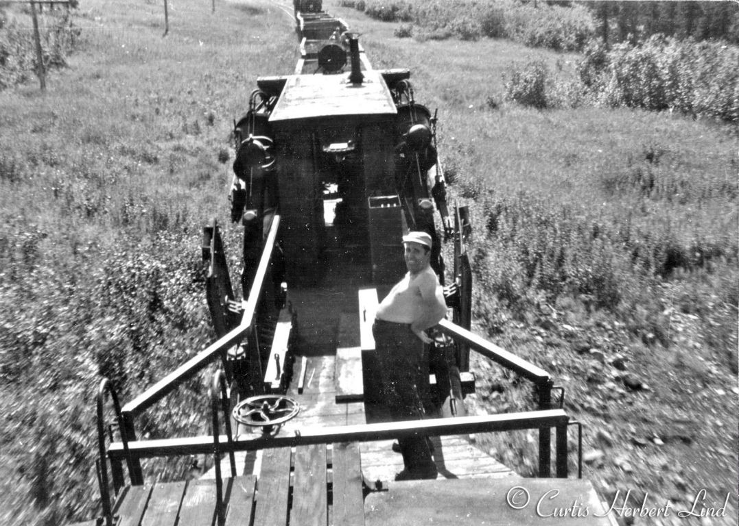 More of the MOW ballast train and we now see there are two Jordan Spreaders, one facing each direction in the consist with a caboose at the end. The photographer was able to take photos 38,39 and 40 from the roof or control cab of the trailing Jordan Spreader. 41 is clearly taken from the top of the caboose. 