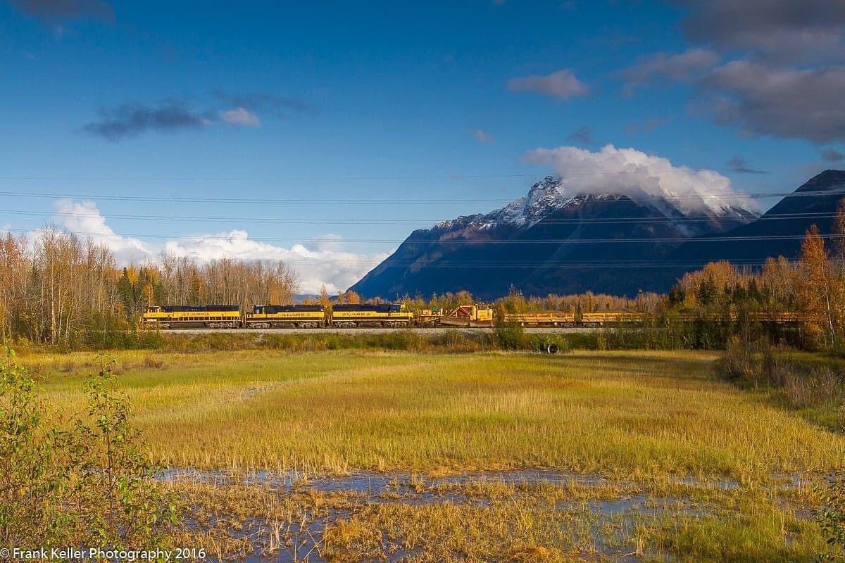 The work train rolls by Pioneer Peak as they head for Matanuska to dump some ballast.